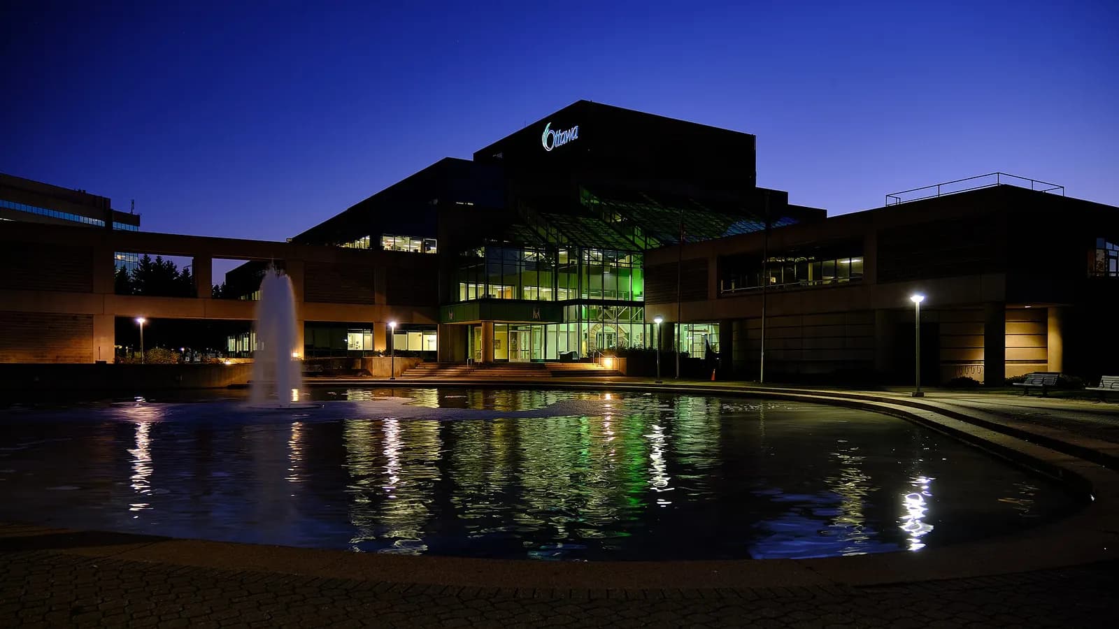 Ben Franklin Place civic building and fountain at dusk